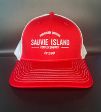 Load image into Gallery viewer, A red and white snapback baseball cap with &#39;SAUVIE ISLAND COFFEE&#39; embroidered on the front.
